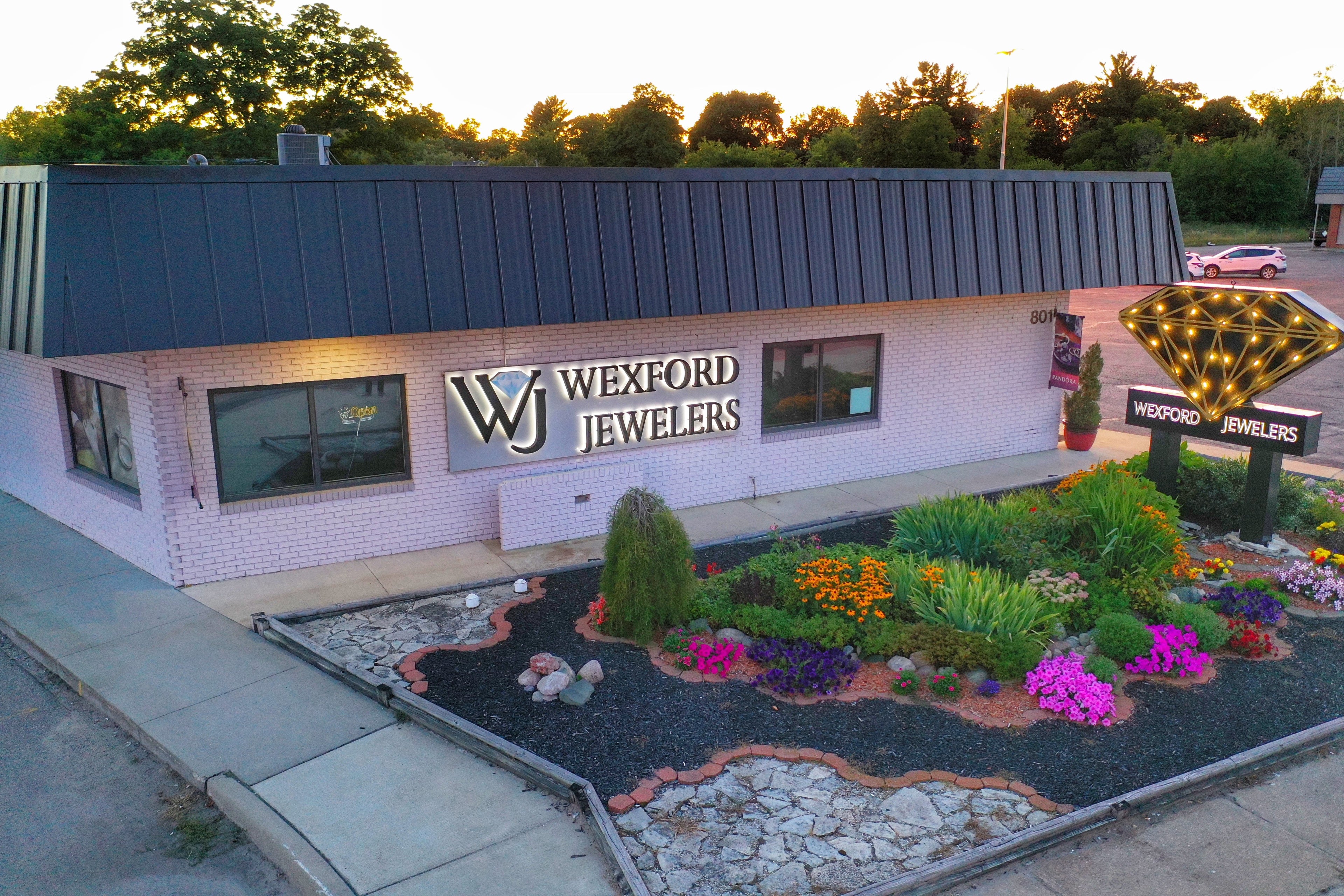 Aerial view of Northern Michigan landmark jewelry store Wexford Jewelers, in full summer bloom
