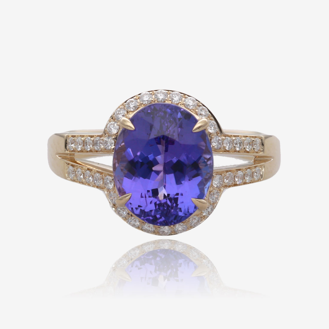 Royal Radiance: Yellow Gold Oval Tanzanite Ring with Diamond Accents