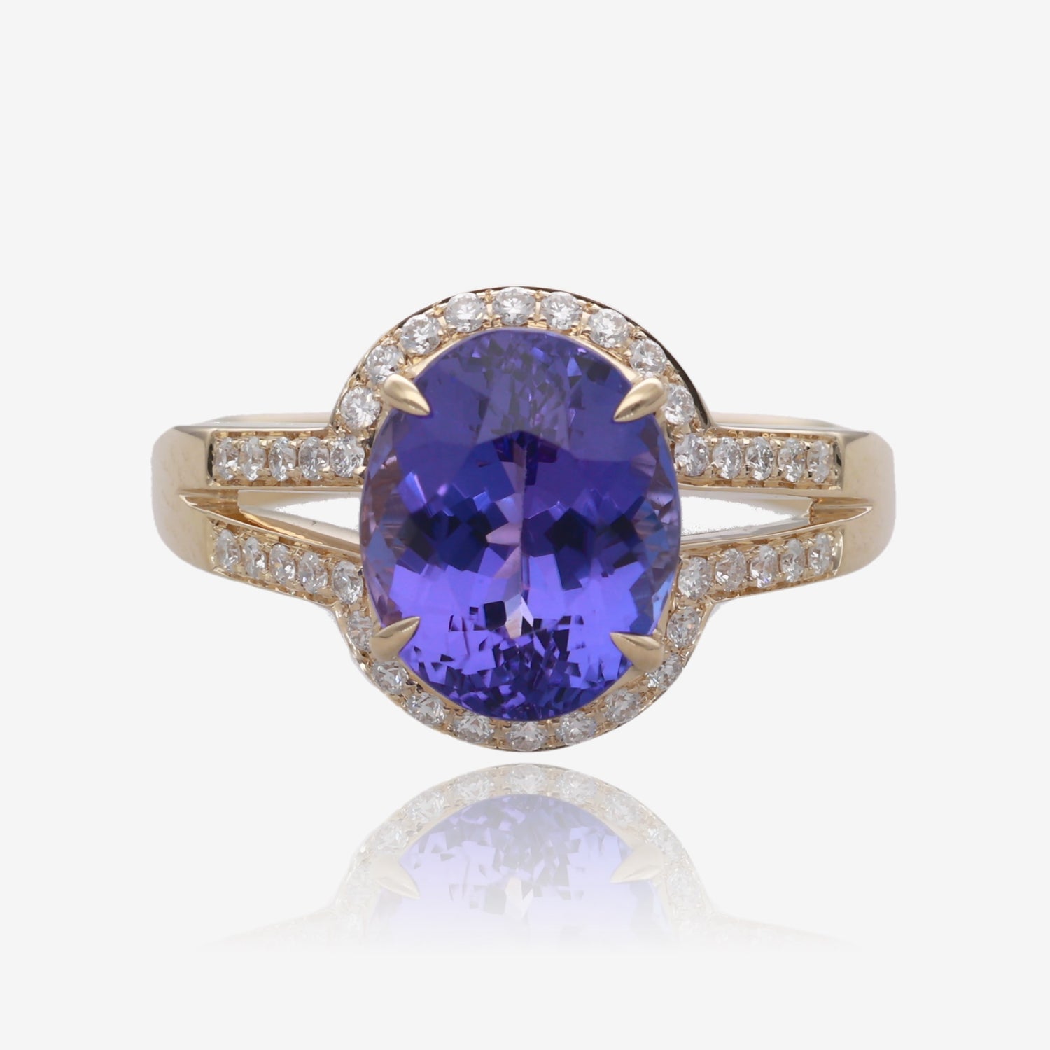 Royal Radiance: Yellow Gold Oval Tanzanite Ring with Diamond Accents