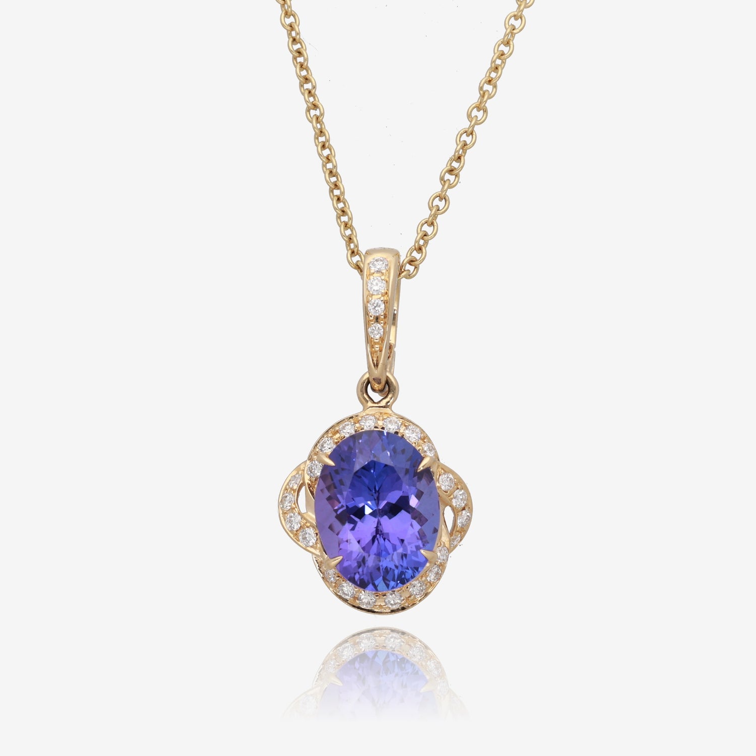 Royal Radiance: Yellow Gold Oval Tanzanite Pendant with Diamond Accents