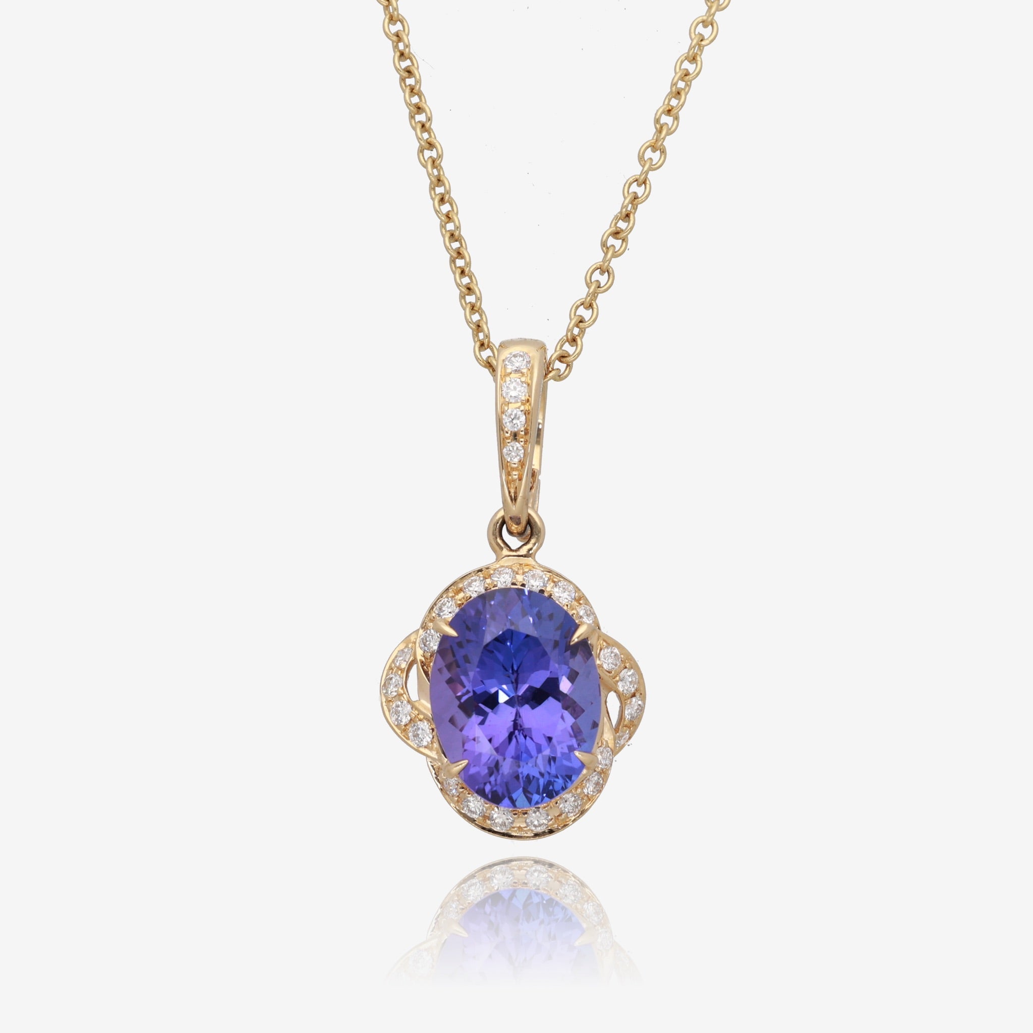 Royal Radiance: Yellow Gold Oval Tanzanite Pendant with Diamond Accents