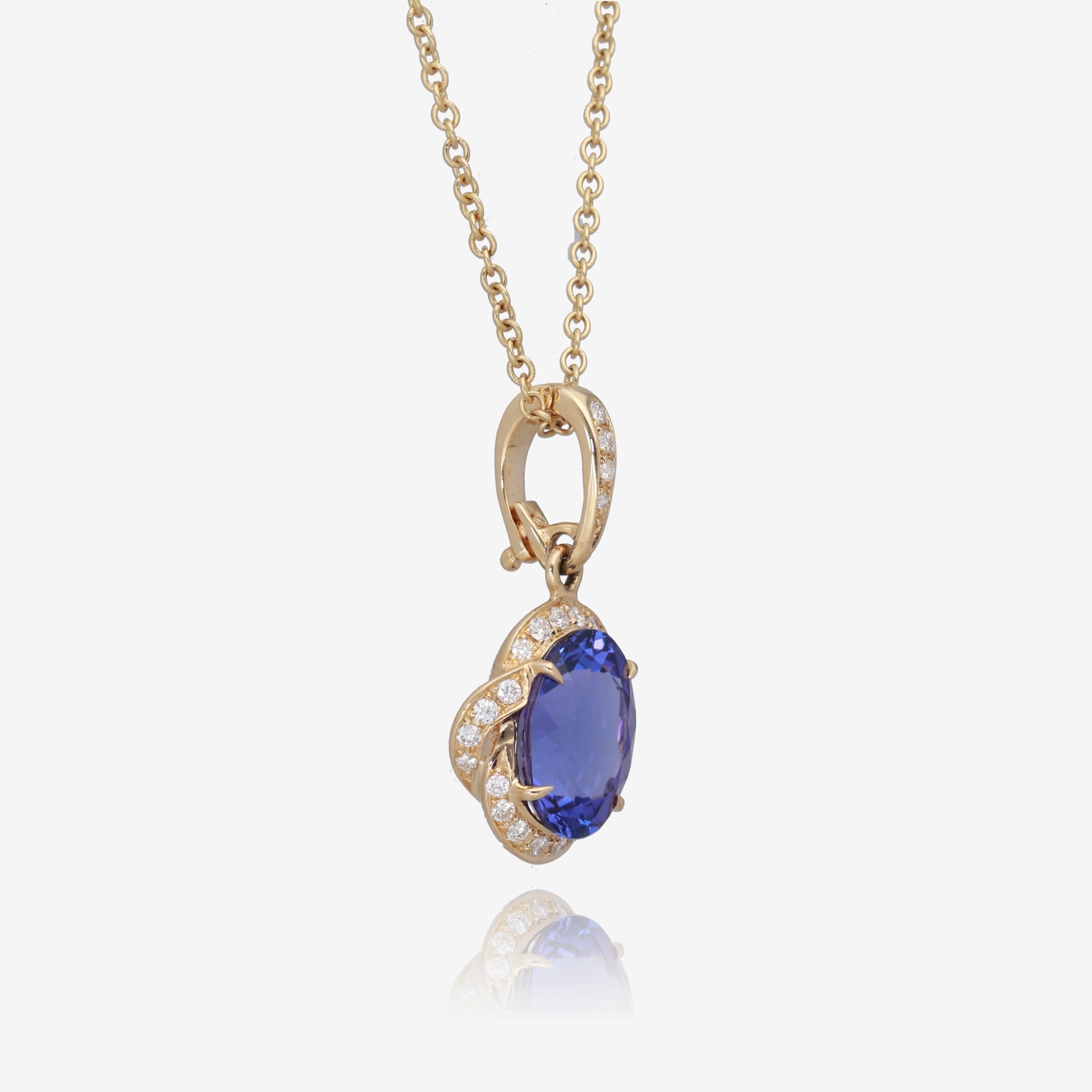 Royal Radiance: Yellow Gold Oval Tanzanite Pendant with Diamond Accents