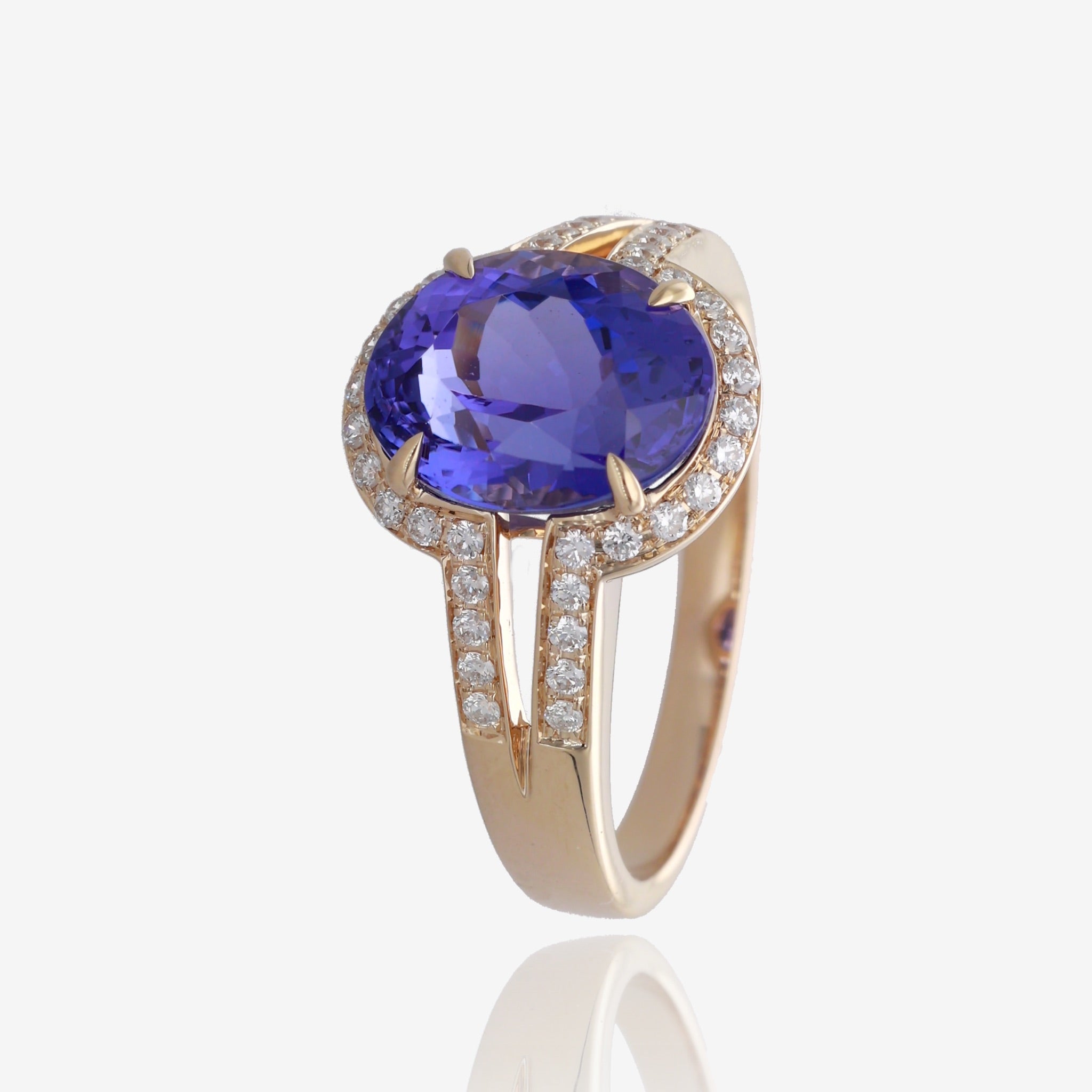 Royal Radiance: Yellow Gold Oval Tanzanite Ring with Diamond Accents