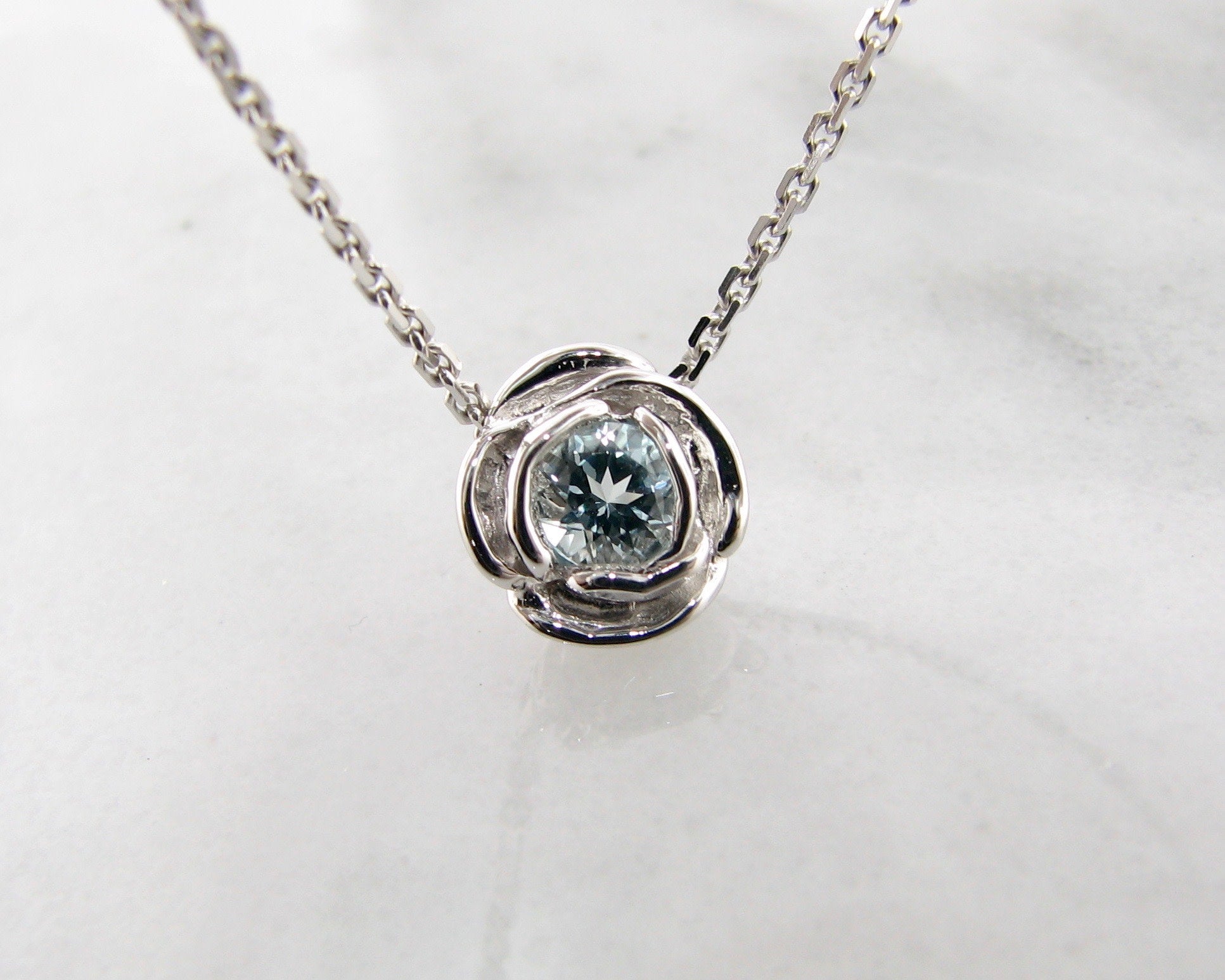 aquamarine-silver-rose-shaped-necklace-wexford-jewelers