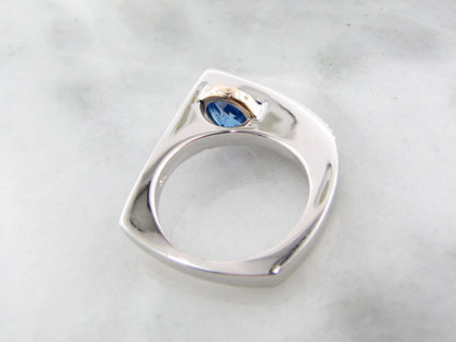 Blue topaz ring in sterling silver with topaz and white sapphire with 14k yellow gold.