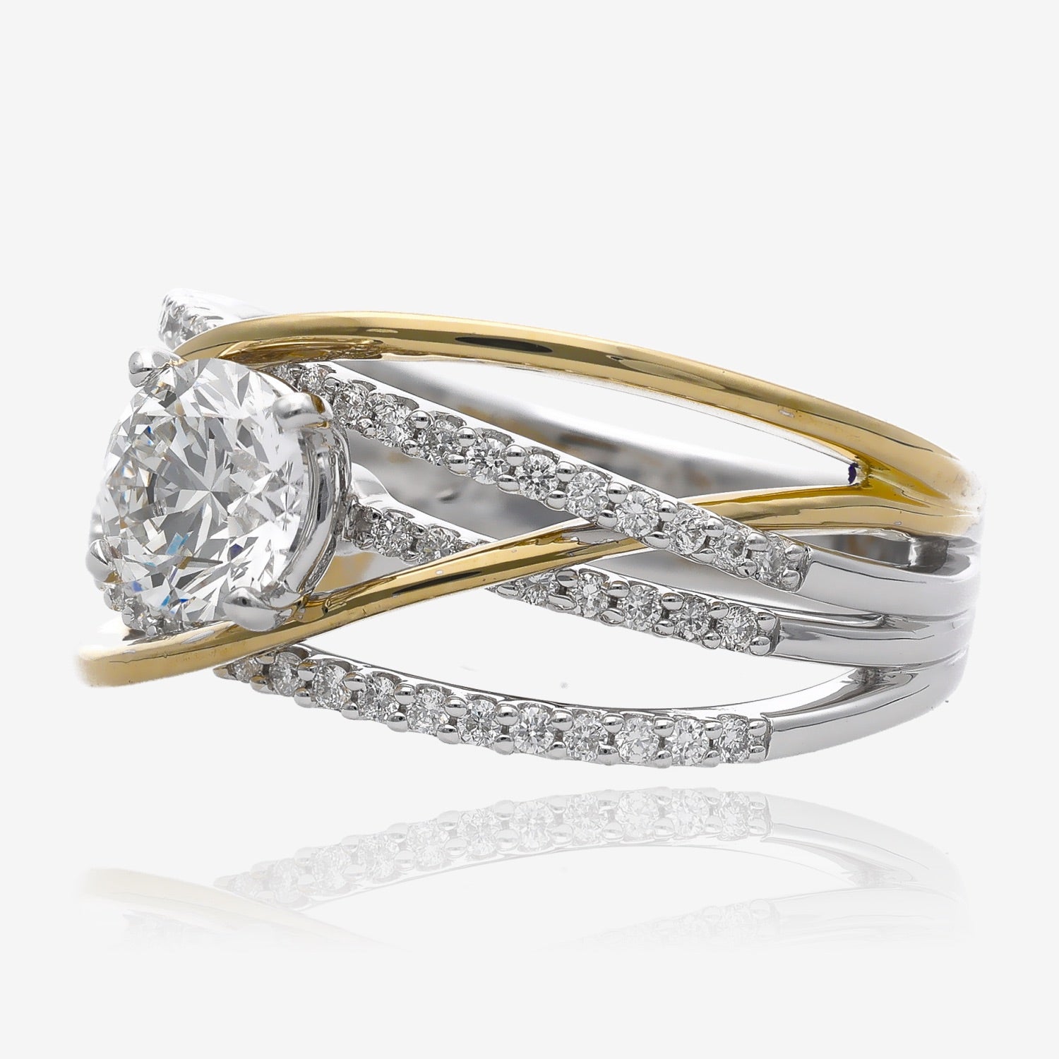 Side view of half inch wide ring, crafted in interwoven yellow and white gold. The white gold lines are studded with small diamonds all down the band. Central larger diamond sits on top of the ring.