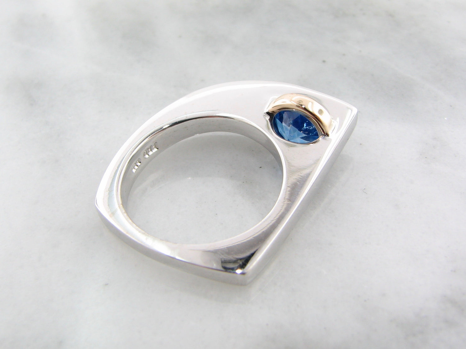 Blue topaz ring in sterling silver with topaz and white sapphire with 14k yellow gold.