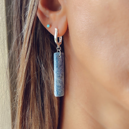 Woman wearing Blue aventurine long dangle earrings in paddle shape with silver lever back tops