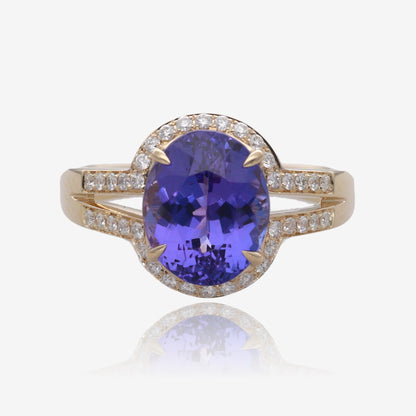 Royal Radiance: Yellow Gold Oval Tanzanite Ring with Diamond Accents