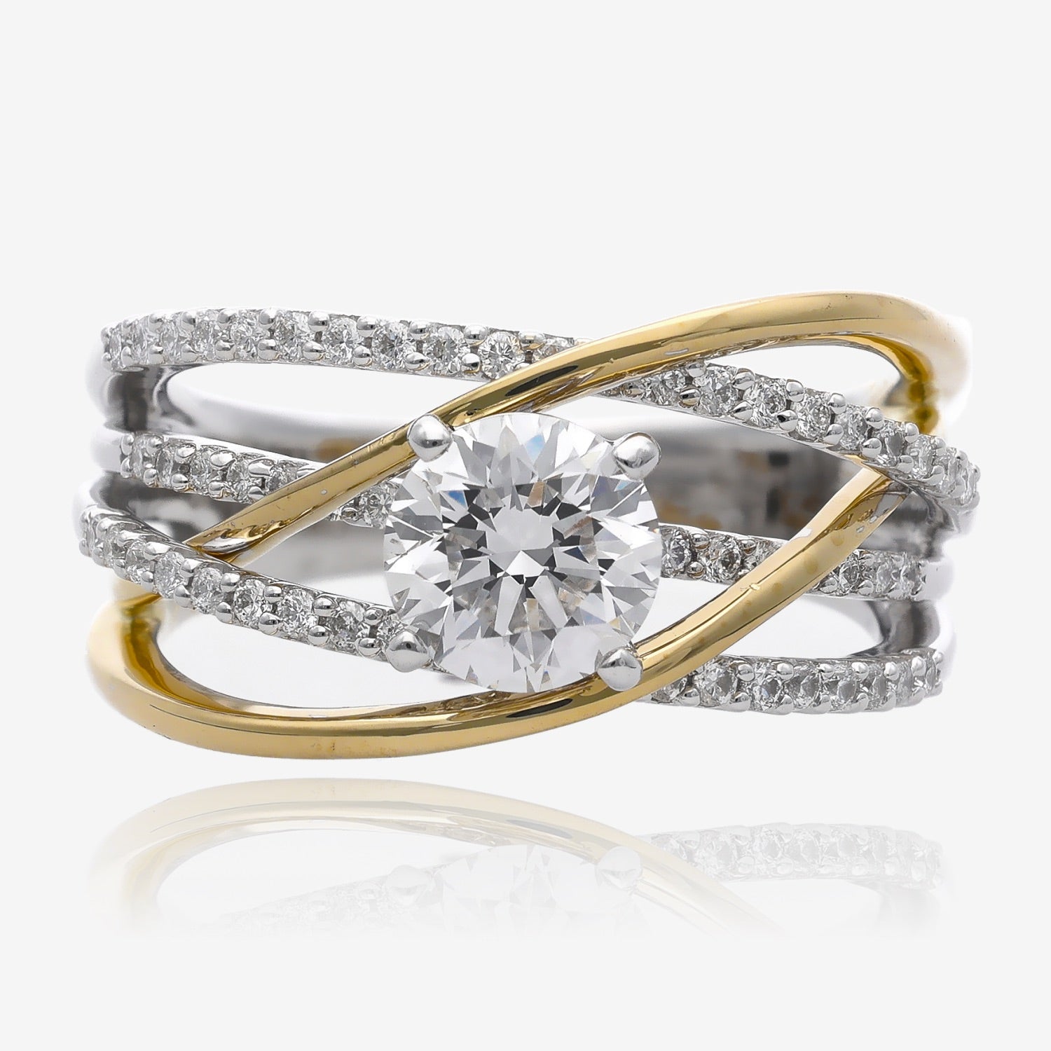 Wide band with two colors of gold intertwined in narrow ribbons. The yellow gold is smooth, polish into ribbons. The white gold is in three ribbons all set with tiny diamonds. In the center there is a one carat round diamond set in four prongs.