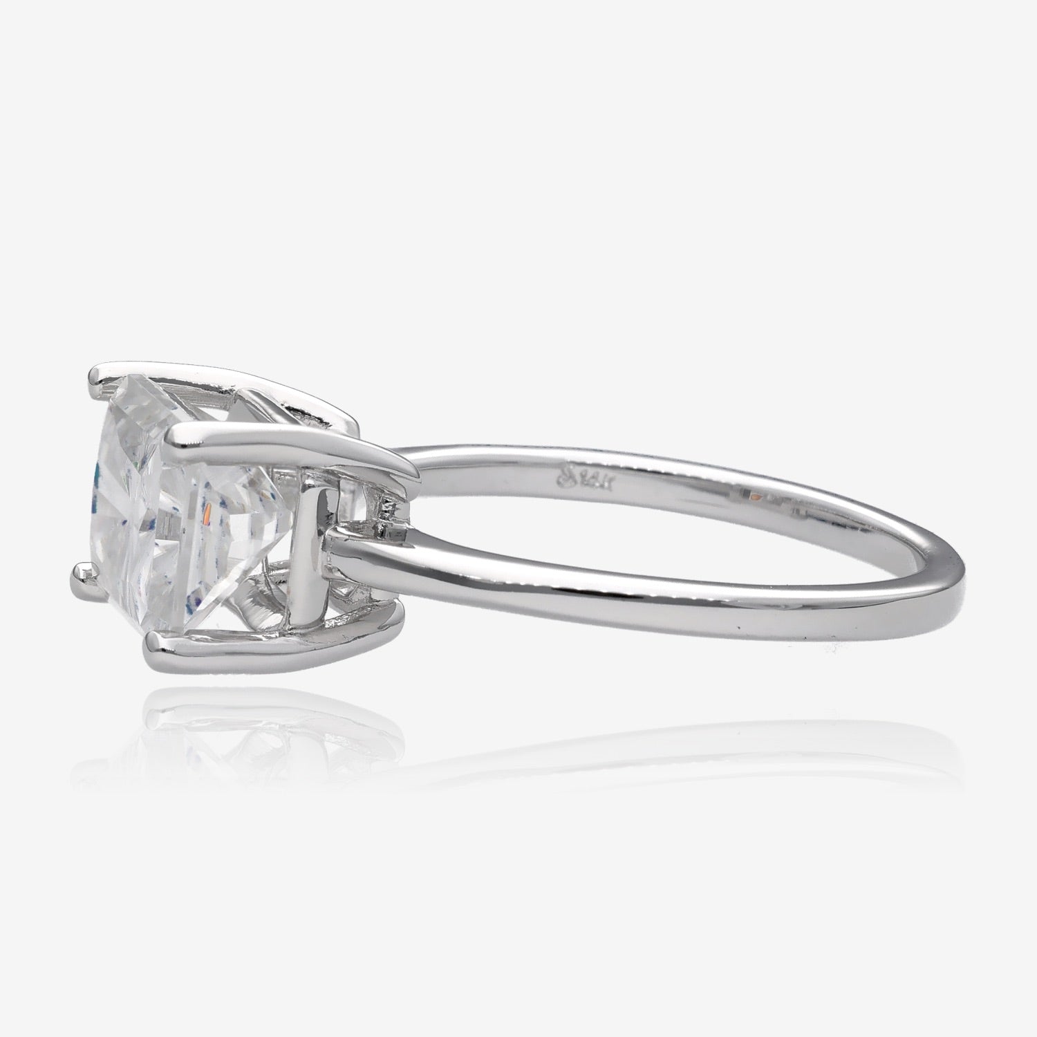 Side view Large radiant rectangular cut white moissanite set east west in a simple slender white gold ring with four prongs