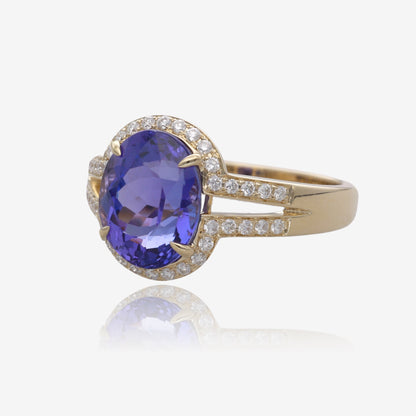 Royal Radiance: Yellow Gold Oval Tanzanite Ring with Diamond Accents