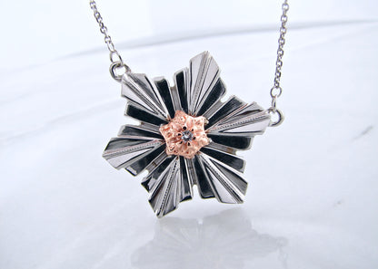 Sterling Silver &amp; 14K Rose Gold
.05ct Diamond