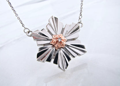 Sterling Silver &amp; 14K Rose Gold
.05ct Diamond