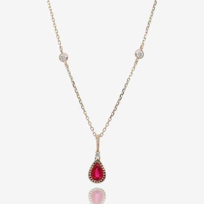 Natural Pear Shaped Ruby and Diamond Pendant in 14K Yellow Gold