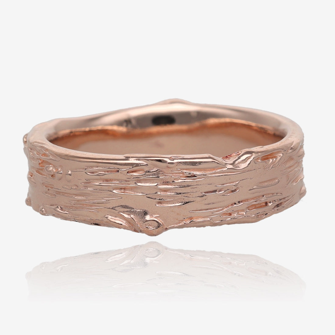 Image shows pink gold band 6mm wide, with raised and recessed lines resembling birch bark. Texture includes knots and divots and slight rough areas.