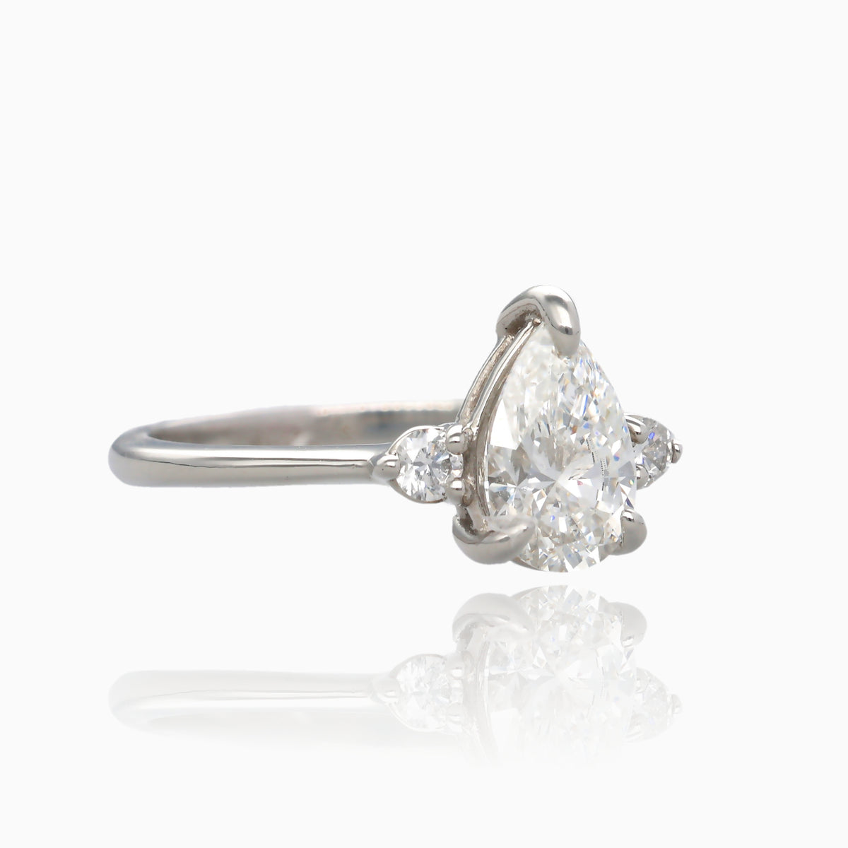 1ct Pear Shape Pure Grown Diamond 1.10TDW Three Stone Platinum Ring