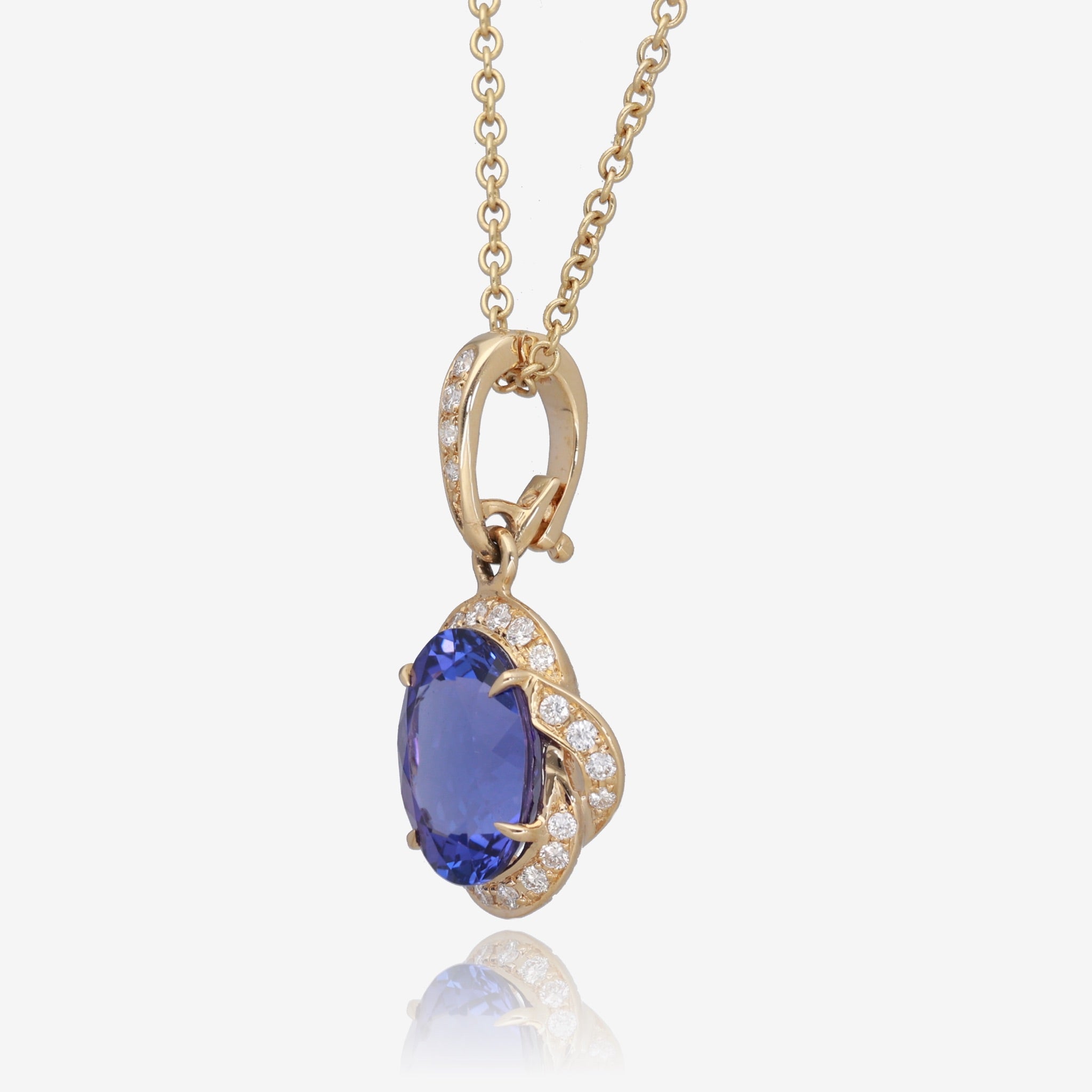 Royal Radiance: Yellow Gold Oval Tanzanite Pendant with Diamond Accents