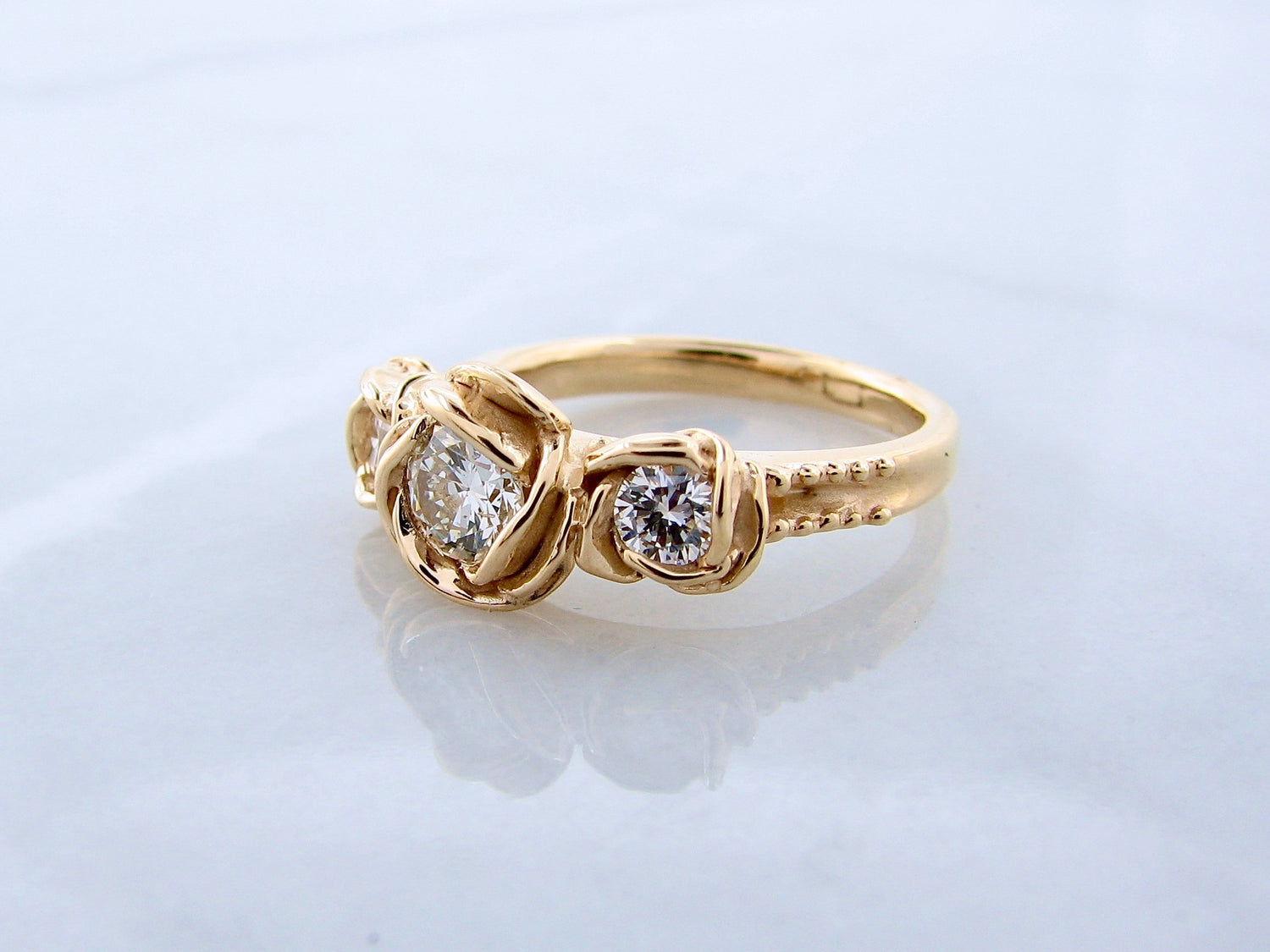 rose-ring-yellow-gold-diamond-three-stone-wexford-jewelers