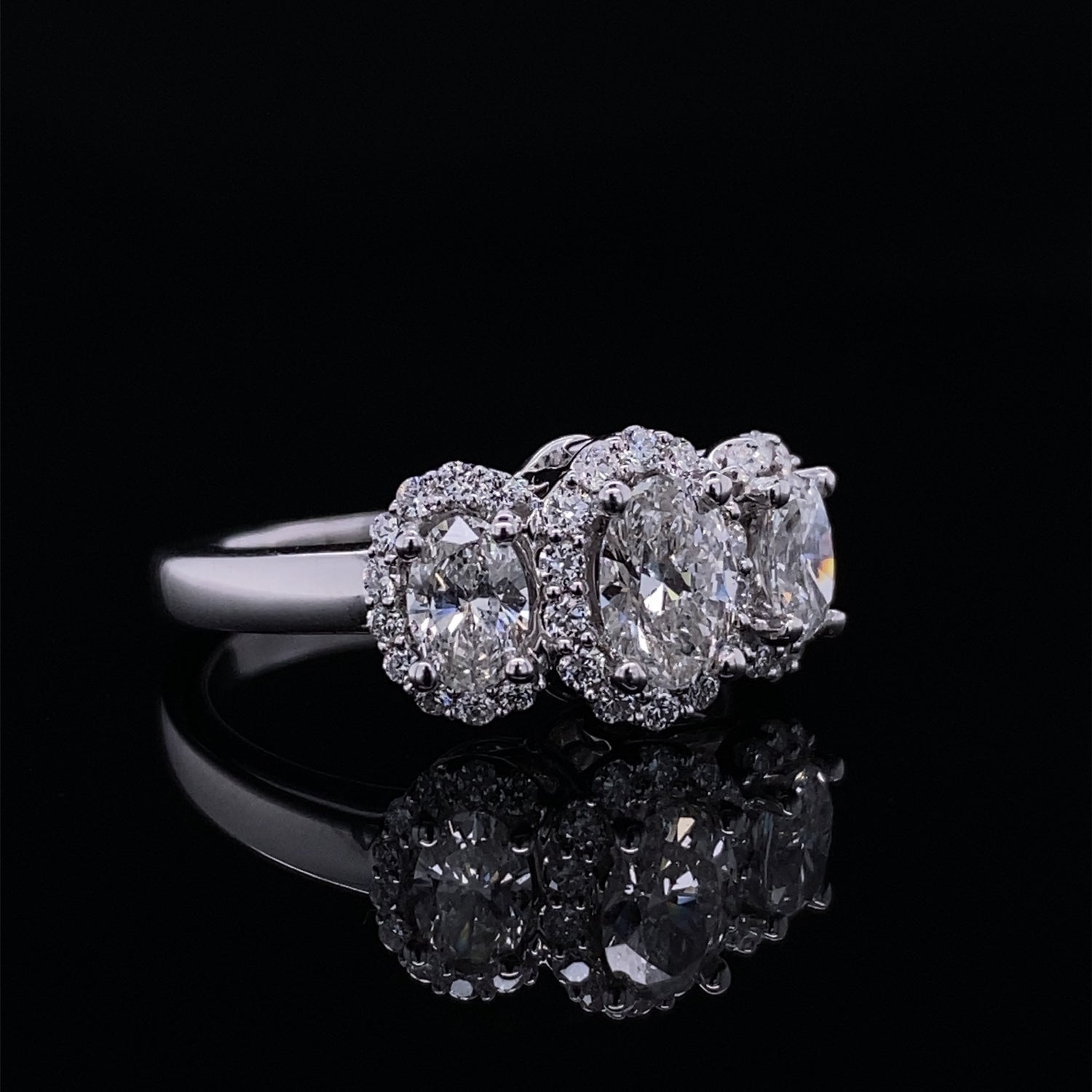 Past Present Future Oval Halo Diamond Ring