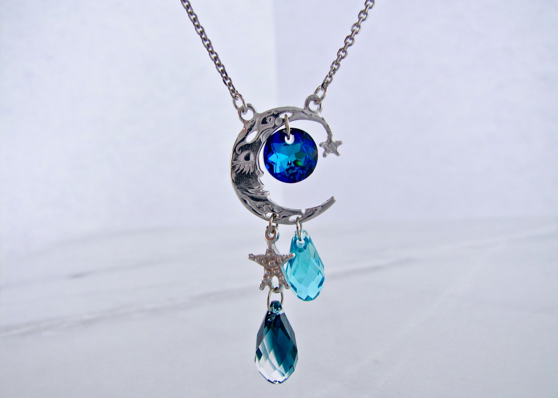 Iridescent Blue Moon Face Pendant (CECupdt) on a Silver chain Necklace -  Helia Beer Co