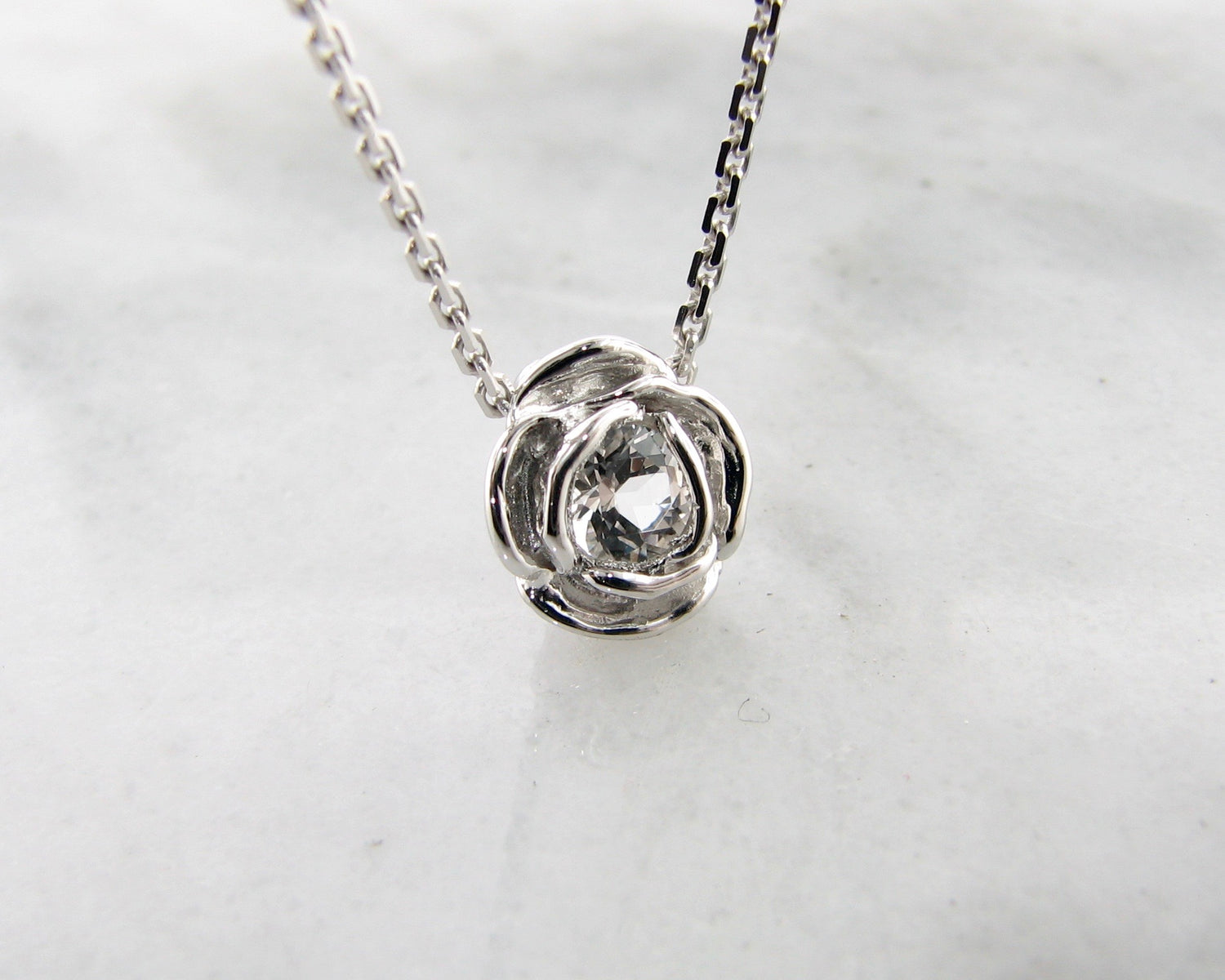 Silver White Topaz April Birthstone Necklace, Rose Slider