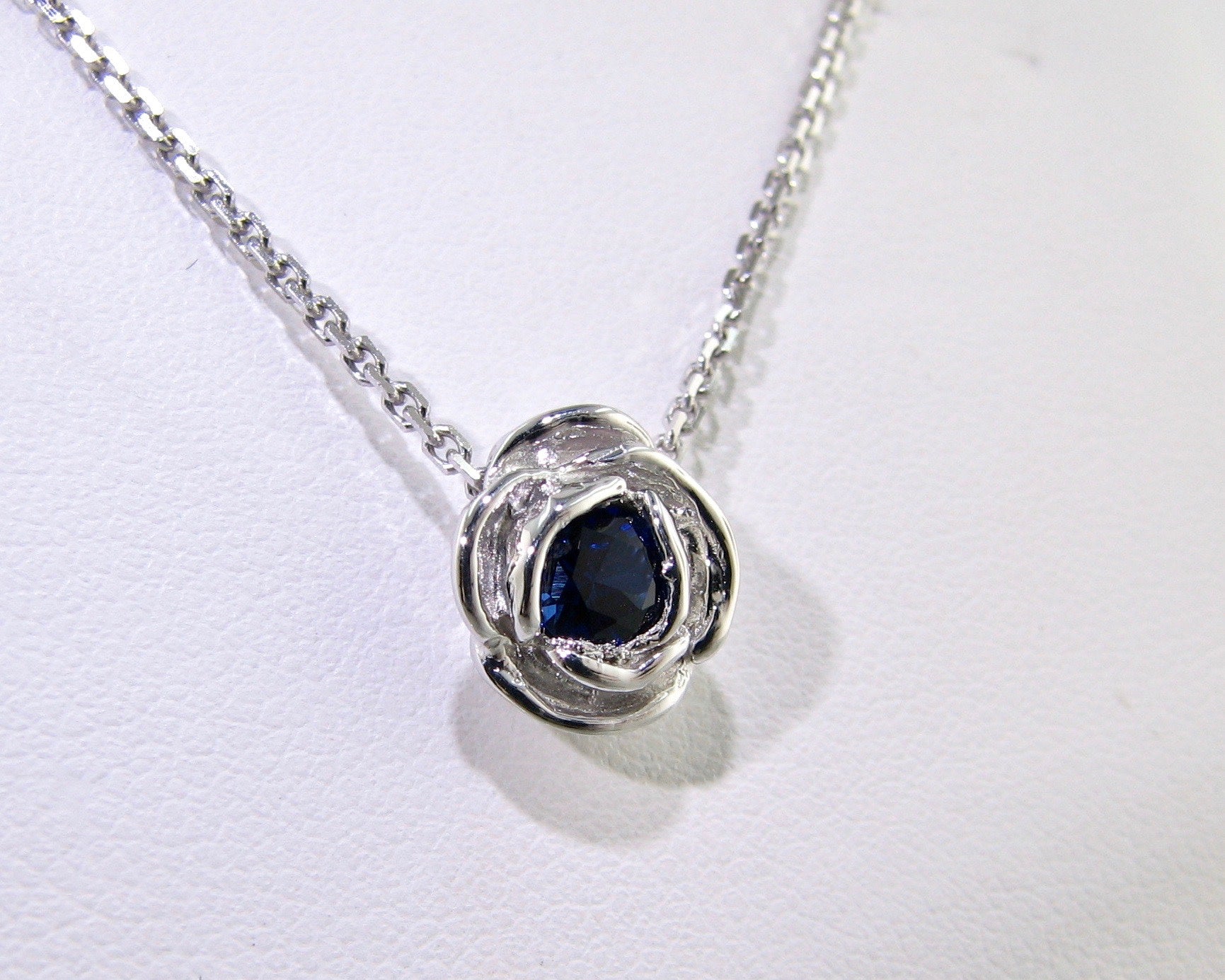 silver-blue-sapphire-rose-shaped-necklace-wexford-jewelers